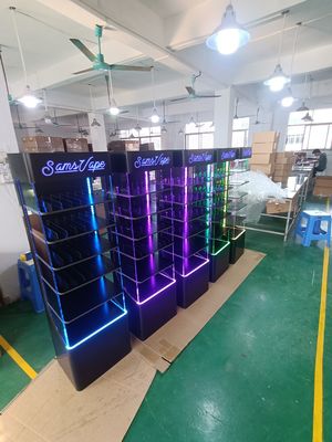 Display de acrílico montado en el piso y con soporte para productos electrónicos