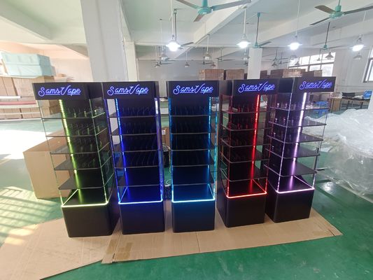 Display de acrílico montado en el piso y con soporte para productos electrónicos